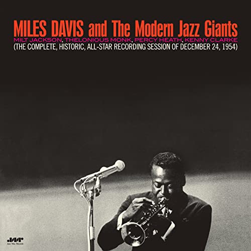 Miles Davis playing trumpet, album cover with red text on a dark background.