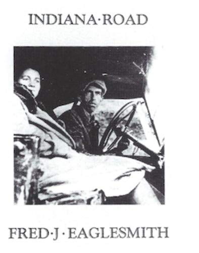 "Album cover with black and white image of two men in a car."