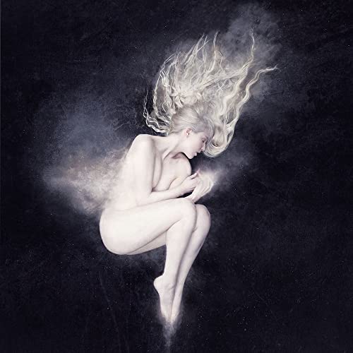 Woman with long hair, surrounded by swirling light, album cover.