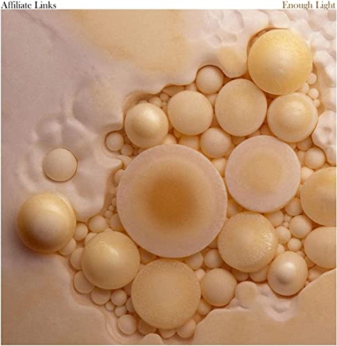 Vinyl record cover with abstract, swirling beige and cream colored bubbles.