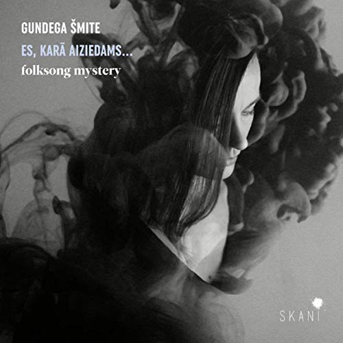"Black and white album cover with a woman's face surrounded by dark, flowing hair."