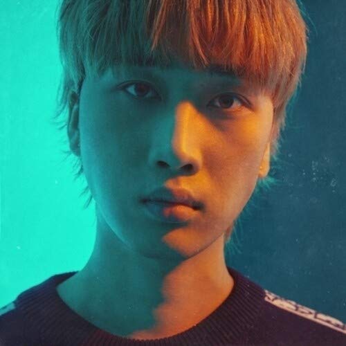 "CD album cover featuring a close-up portrait of a young man with short hair."