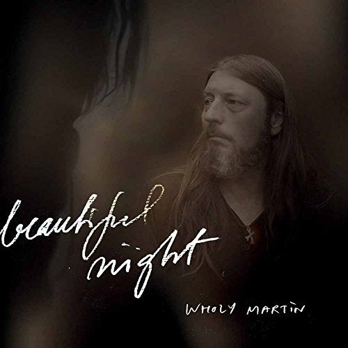 Dark portrait of Wholy Martin with album title "Beautiful Night".