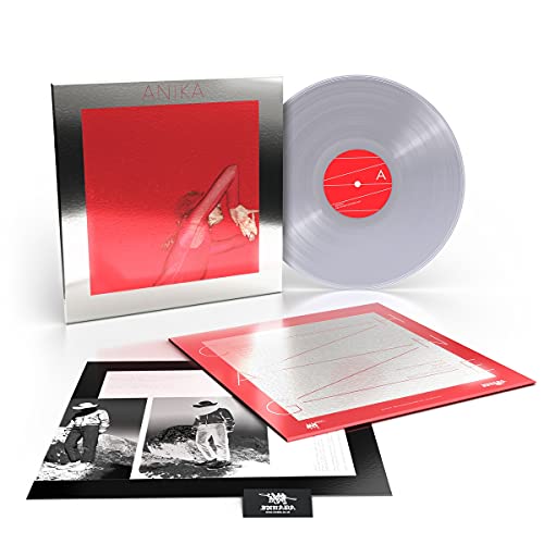 Anika Change vinyl record, cover art, and inserts displayed on a white background.