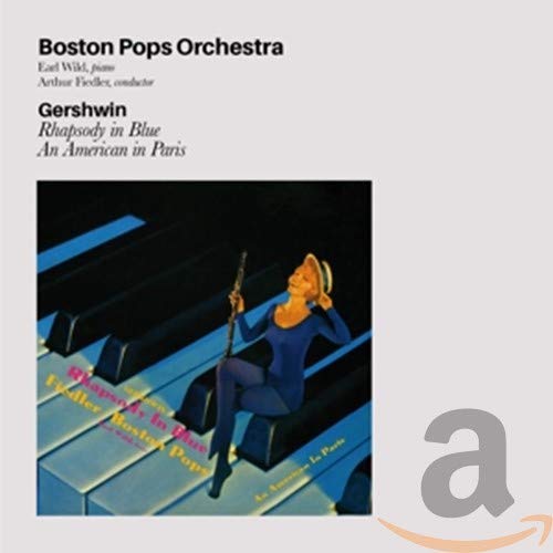 "CD cover with cartoon pianist on keyboard, white background, and Amazon logo."