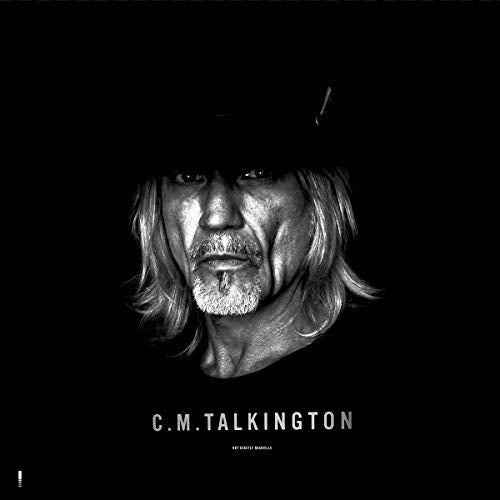 Black and white album cover featuring a man with long hair and a hat.