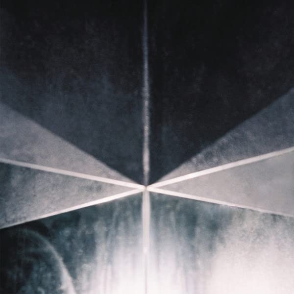 Dark abstract vinyl record cover with converging white lines.