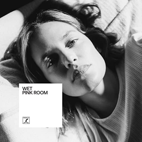 Black and white portrait of a woman with album cover overlay.