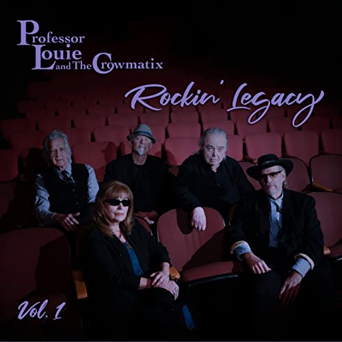 Professor Louie & The Crowmatix band portrait in a theater setting.