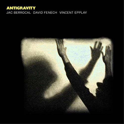 CD cover: shadow of raised hands against a bright square.