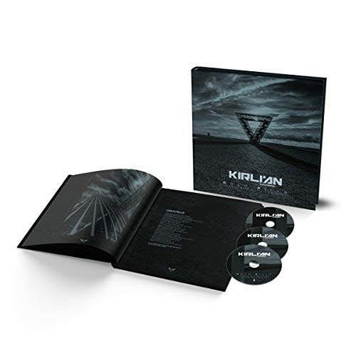 Black hardback CD package with three discs and open booklet shown.