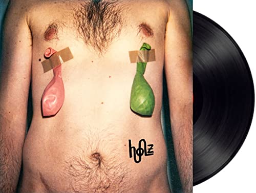 Album cover featuring a torso with balloons taped to the chest, vinyl record.