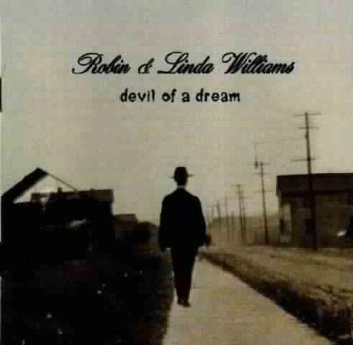 "CD cover with man walking down a country road, sepia-toned image, artist names at top."