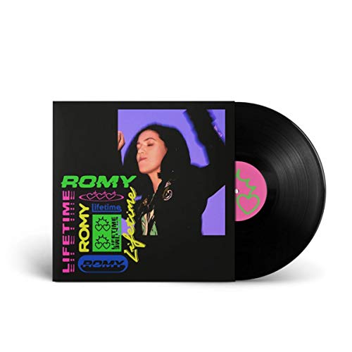 Romy “Remixes” vinyl record with a portrait of a woman in black.