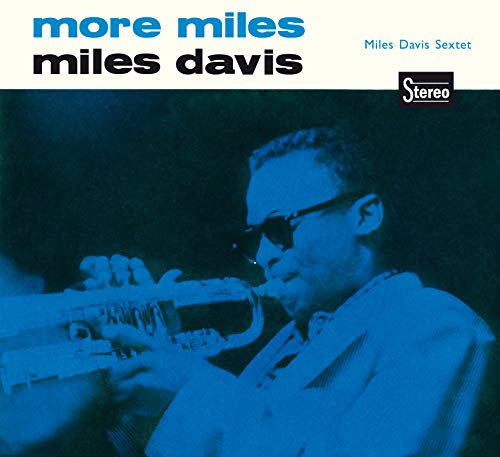 "CD cover with blue-toned image of Miles Davis playing trumpet."