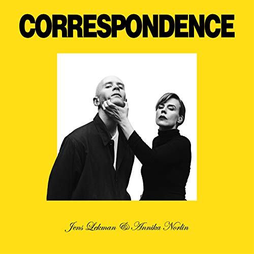 Yellow album cover featuring a black and white photo of two people.