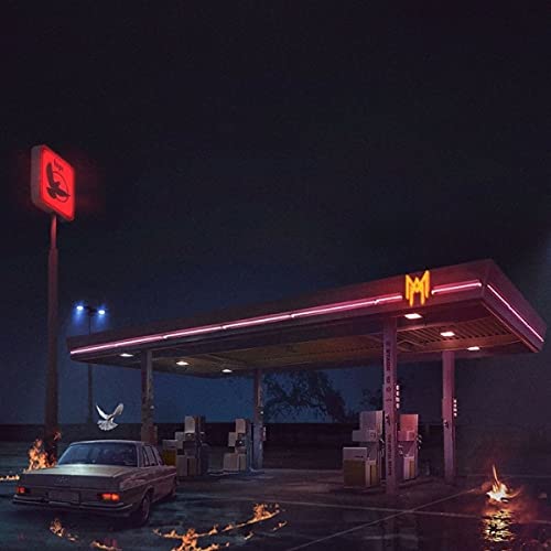 Nighttime gas station with a white car parked beneath glowing neon lights.