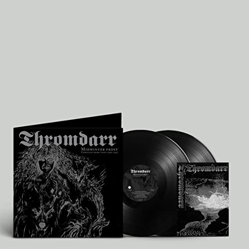 Black vinyl records and album cover with dark, gothic artwork.