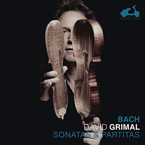 Violinist David Grimal holding violin parts, album cover for Bach sonatas.