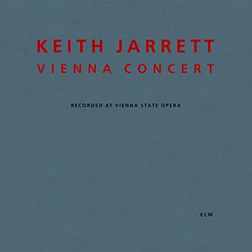 "Blue-grey album cover with red and black text, featuring 'Keith Jarrett Vienna Concert'."