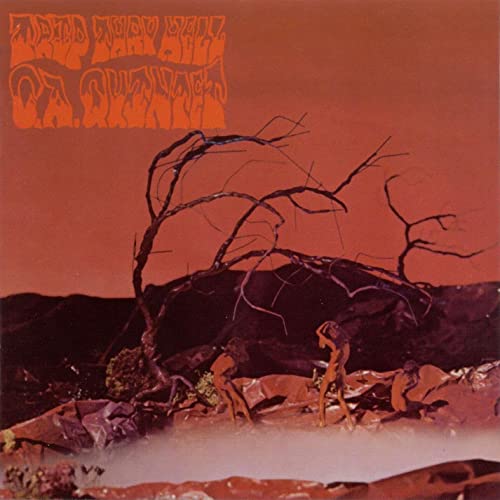 Album cover: desert landscape with twisted tree and figures.