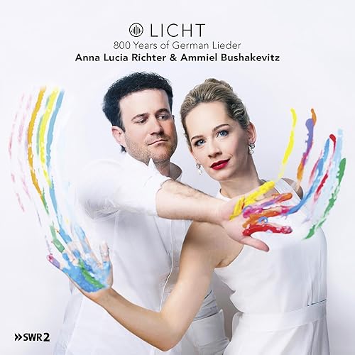 CD cover featuring a man and woman with colorful paint streaks.
