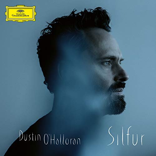 Album cover for Dustin O'Halloran's "Silfur" featuring a portrait of the artist.