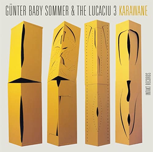 CD cover for “Karawane” featuring four abstract, golden geometric sculptures.