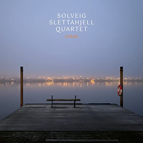 Album cover for Solveig Slettahjell Quartet’s “Gullokk” featuring a misty dock scene.