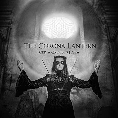 CD cover with a person in dark clothing and a glowing orb.