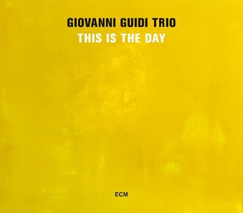 Yellow album cover with "Giovanni Guidi Trio - This is the Day" text and "ECM" logo.