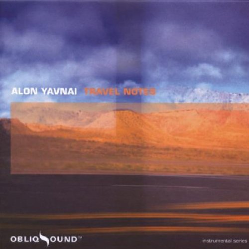 "Album cover with desert landscape, mountains, and cloudy sky, featuring 'Alon Yavnai - Travel Notes'."