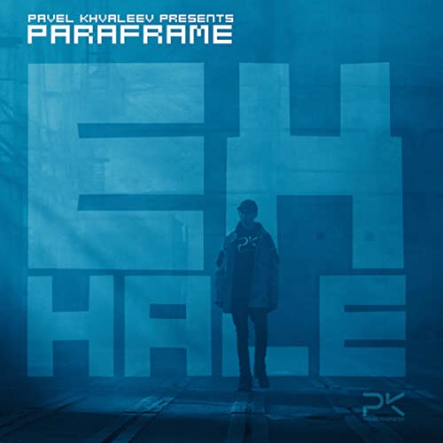 CD cover: man standing in front of large, abstract letters.