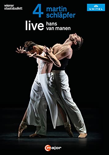 Two ballet dancers in white trousers perform an expressive pose against a black background.