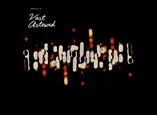 Black album cover with white text "Vast Asteroid" and abstract, glowing, red and white shapes.