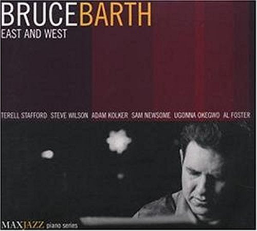 "Album cover with a man at a piano, red curtain background, and white text."