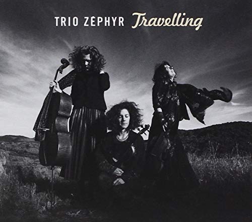 Black and white album cover featuring three musicians in a landscape.