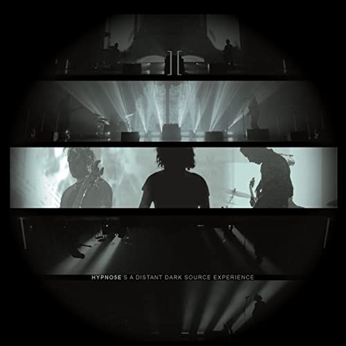 Dark album cover featuring musicians in a dimly lit, fragmented stage setting.
