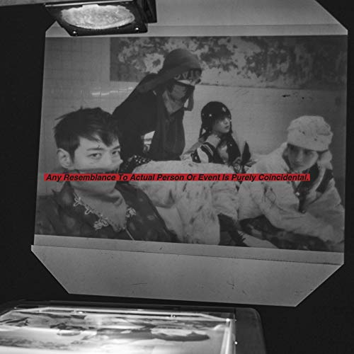 Black and white photo of four people in patterned clothing, SHINee album.