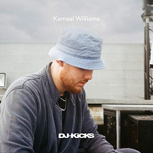 Kamaal Williams album cover featuring a man wearing a blue bucket hat.
