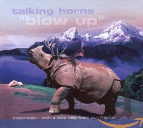 CD cover: a rhino with antlers against a mountain backdrop.