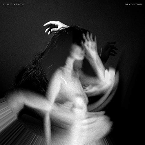 Black and white CD cover with blurred figure and outstretched hand.