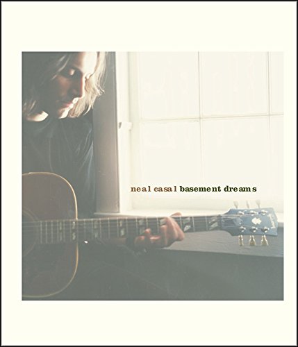 "Album cover with a man playing an acoustic guitar, 'neal casal basement dreams' text."