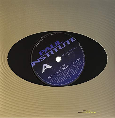Black vinyl record with a white and yellow "Paul Institute" label.