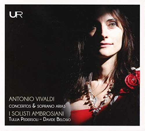 A CD cover featuring a woman in a red dress, surrounded by darkness.