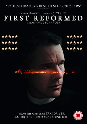 DVD cover for "First Reformed" featuring a priest with flames across his eyes.