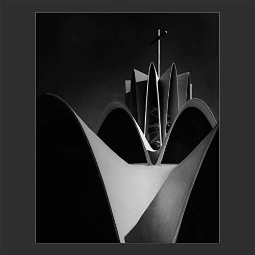 Black and white photo of a modern, angular church exterior.