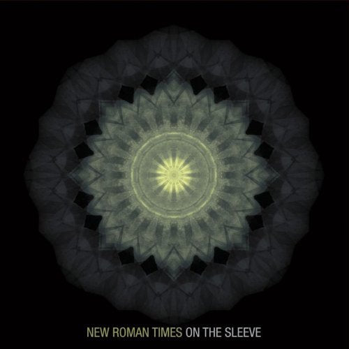 CD cover with a dark, ornate, mandala-like geometric design.