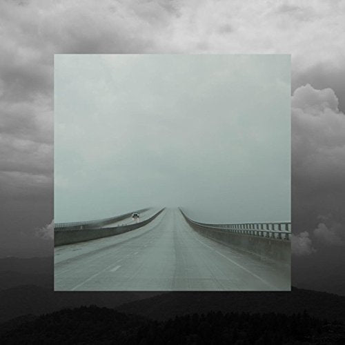 CD cover: a long, empty road receding into a misty, cloudy horizon.