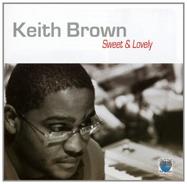 Album cover with a black and white photo of a man wearing glasses.